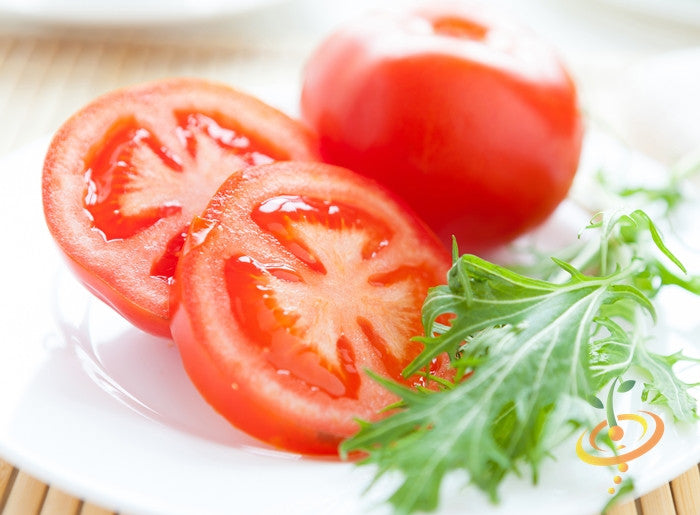 Determinate Tomato seeds from SeedsNow, featuring fresh tomato variety with green stems and seed packaging.