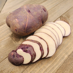 Organic Viking Purple early-season potato seed from SeedsNow-Potatoes, showing round purple tubers with smooth skin.