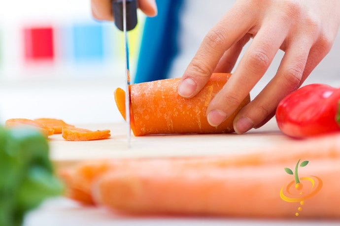 Danvers carrot seeds from SeedsNow, 7-inch long carrot variety, shown in a close-up image with fresh orange carrots and green tops.